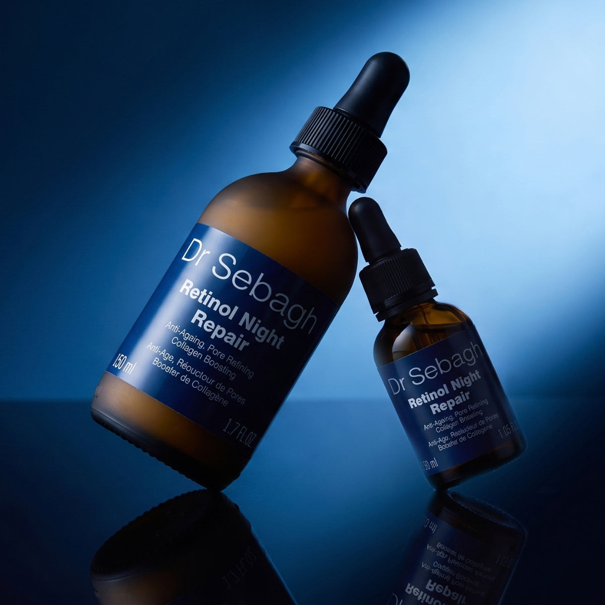 Dr Sebagh Retinol Night Repair 50ml PRO size and 30ml retinol serum bottles on a blue backdrop