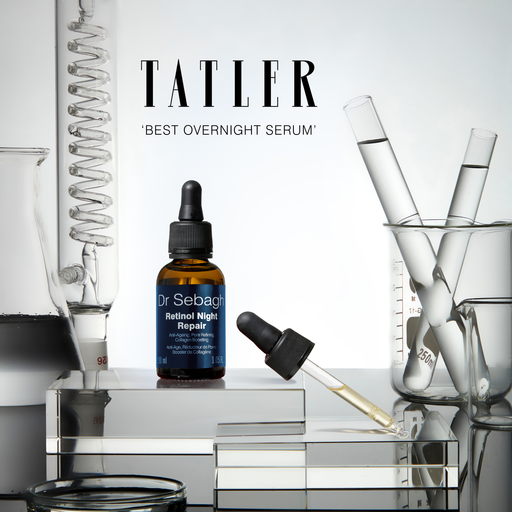 Retinol Night Repair serum displayed among laboratory glassware with a Tatler award for best overnight serum