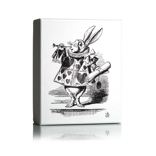 Dr Sebagh Christmas gift box with a white lid printed with Tenniel's illustration of the White Rabbit as herald, blowing a trumpet and holding a scroll