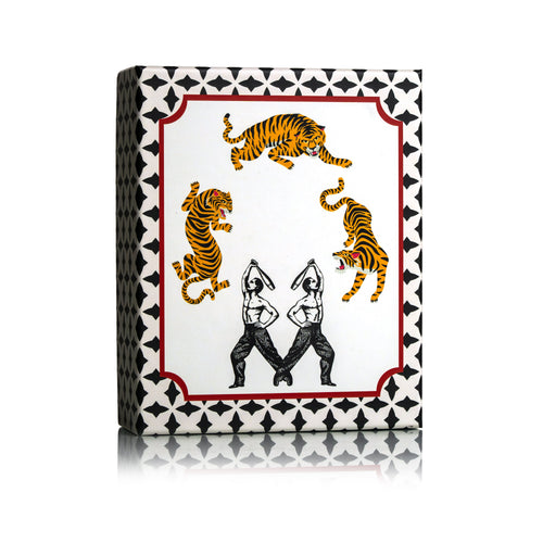 Dr Sebagh Christmas gift box with a black and white geometric border, three vintage circus tigers and two strongmen