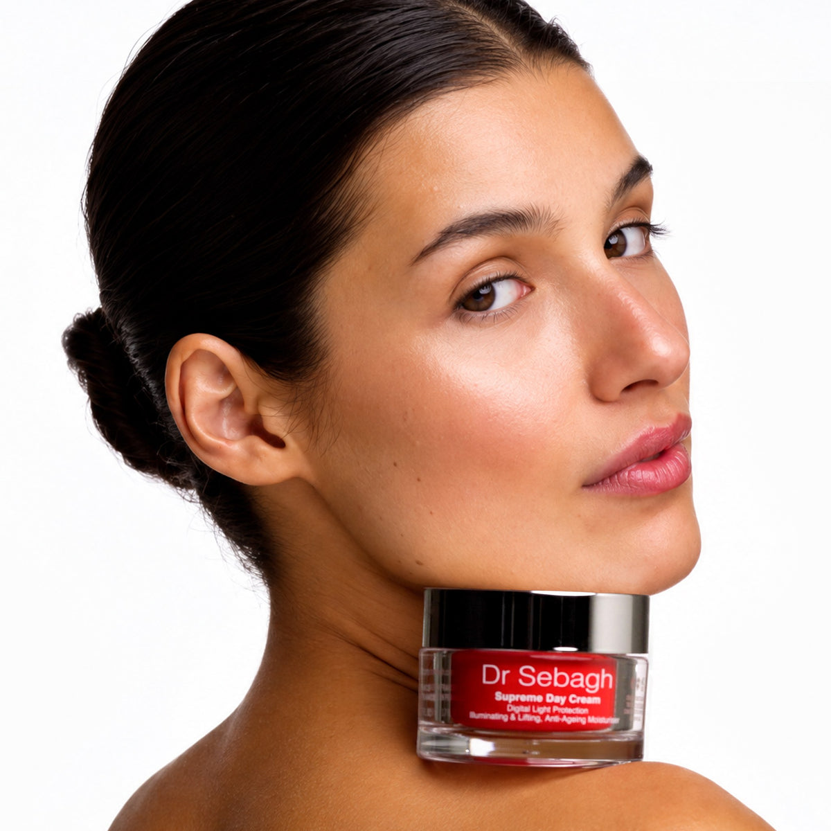 Model with Dr Sebagh Supreme Day Cream jar resting on her shoulder