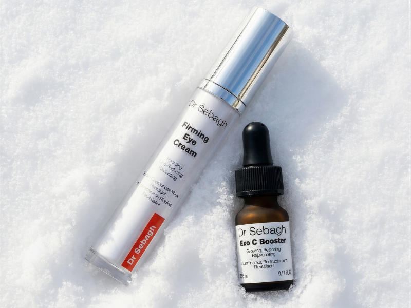 Dr Sebagh Firming Eye Cream and Exo C Booster displayed on snow for the Winter GWP skincare offer.